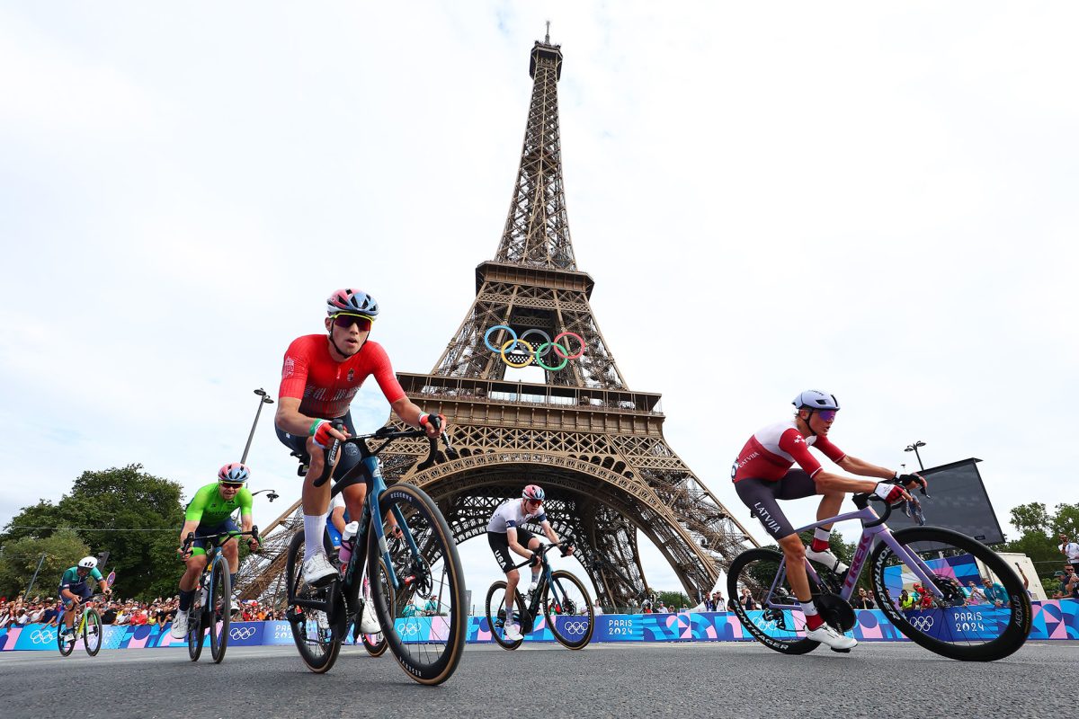 PARIS, FRANCE - AUGUST 03: (L-R) Jan Tratnik of Team Slovenia, Attila Valter of Team Hungary, Matteo Jorgenson of Team The United States, Stefan Kung of Team Switzerland compete with the Eiffel Tower in the background during the Men's Road Race on day eight of the Olympic Games Paris 2024 at trocadero on August 03, 2024 in Paris, France. (Photo by Buda Mendes/Getty Images)